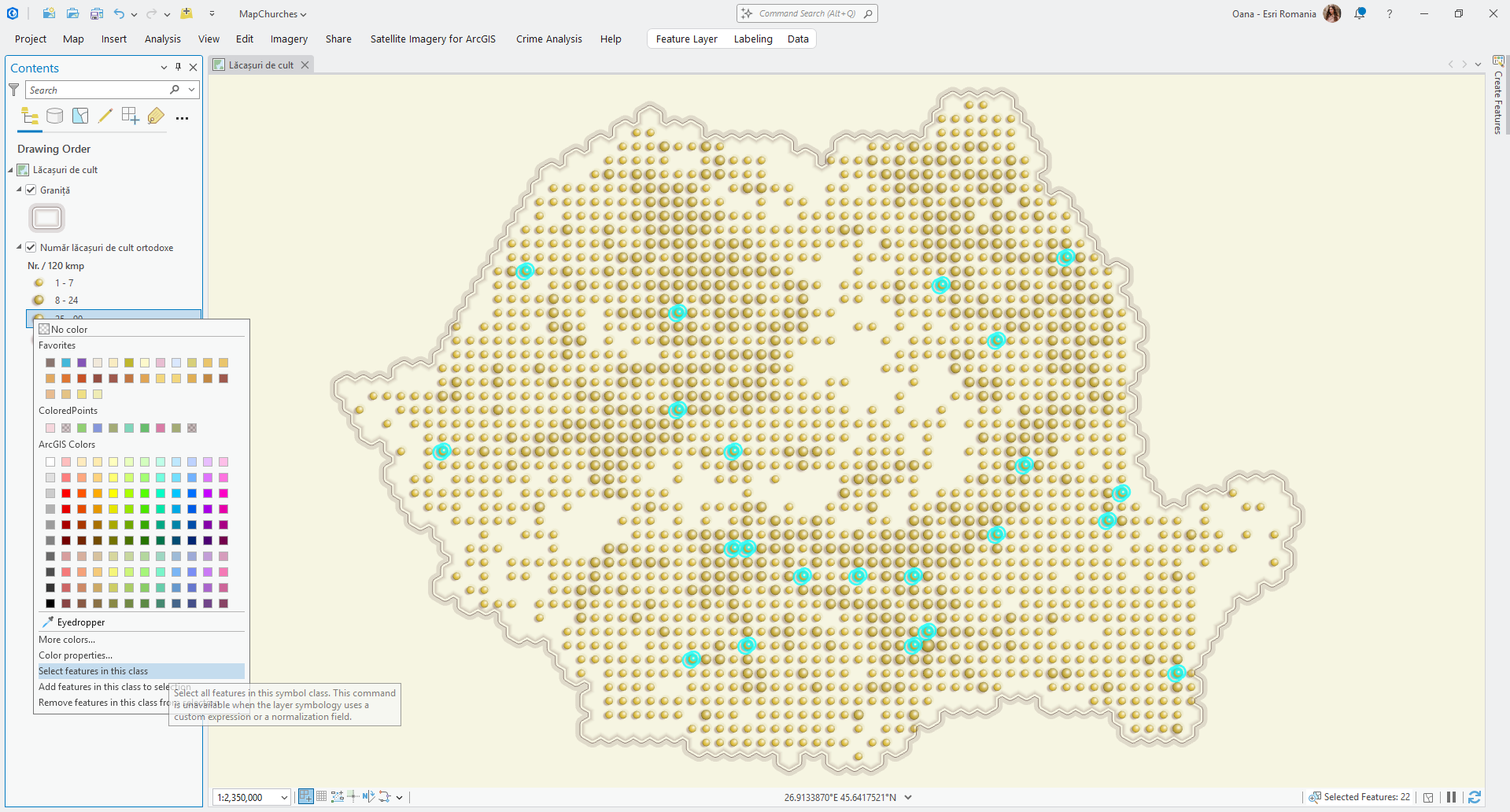 Two people standing outdoors with hands in view both pointing at a tablet with a digital map