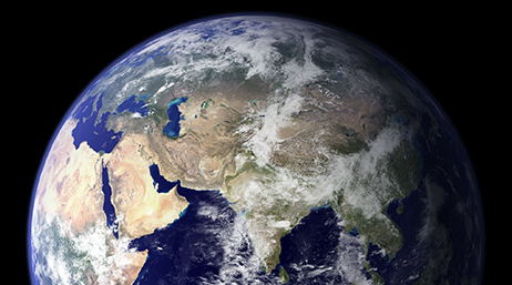 The upper portion of planet Earth taken from a satellite with a black abyss in the background