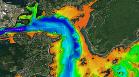 An infrared satellite image of a wide river flowing through rich green land