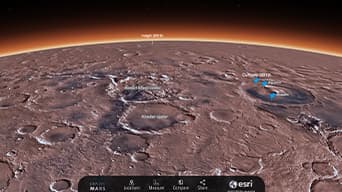 The surface of Mars in dull red with major craters labeled in white text under a black sky