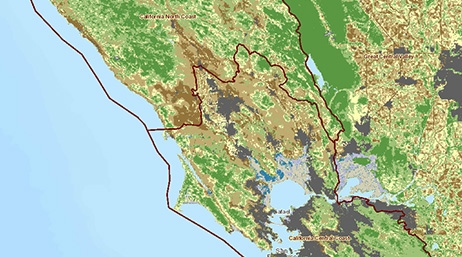 A topographic map of a coastal region in eastern North America with areas outlined in red