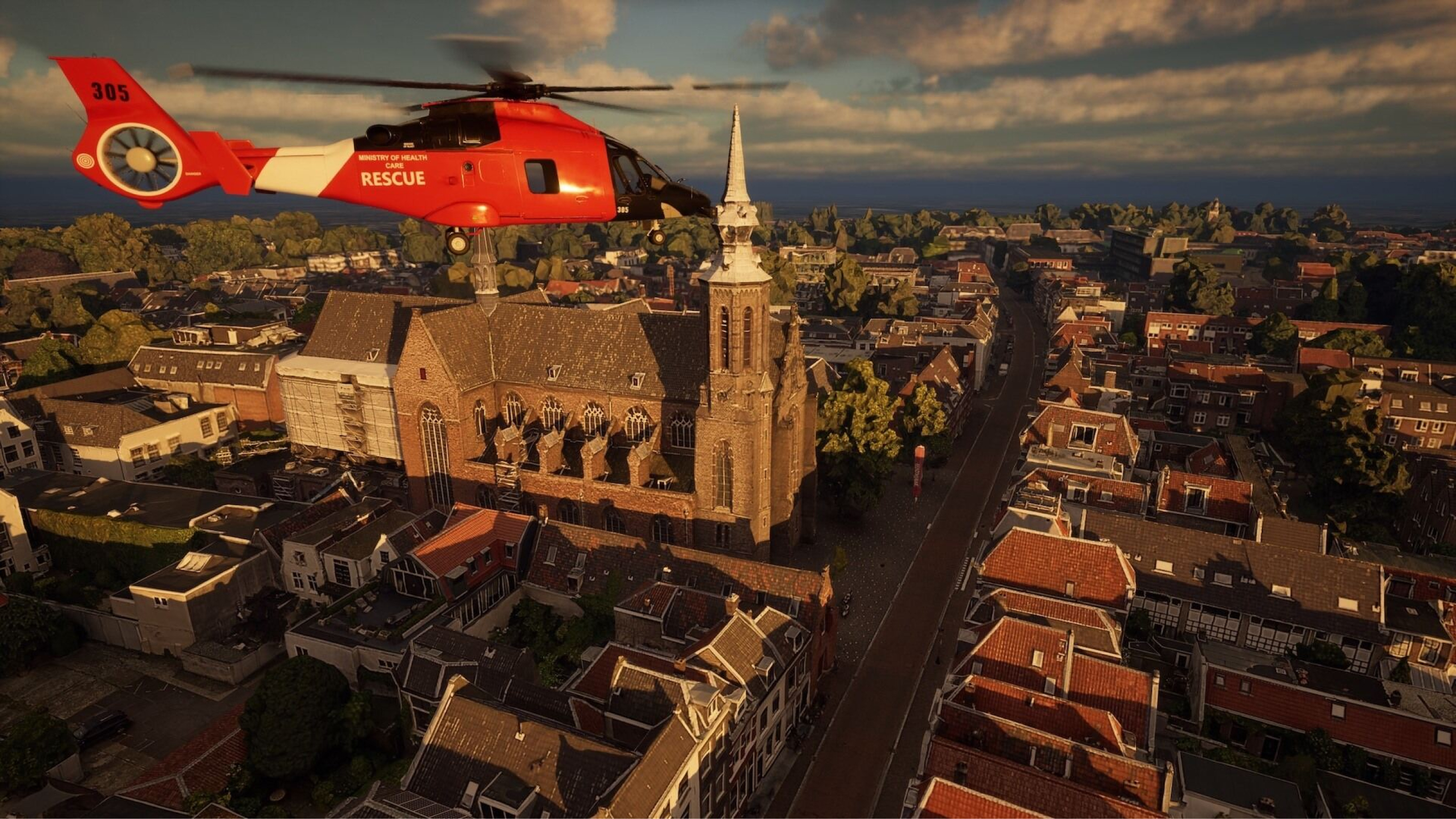 European city with old buildings and cobblestone streets and a red and black rescue helicopter in the sky