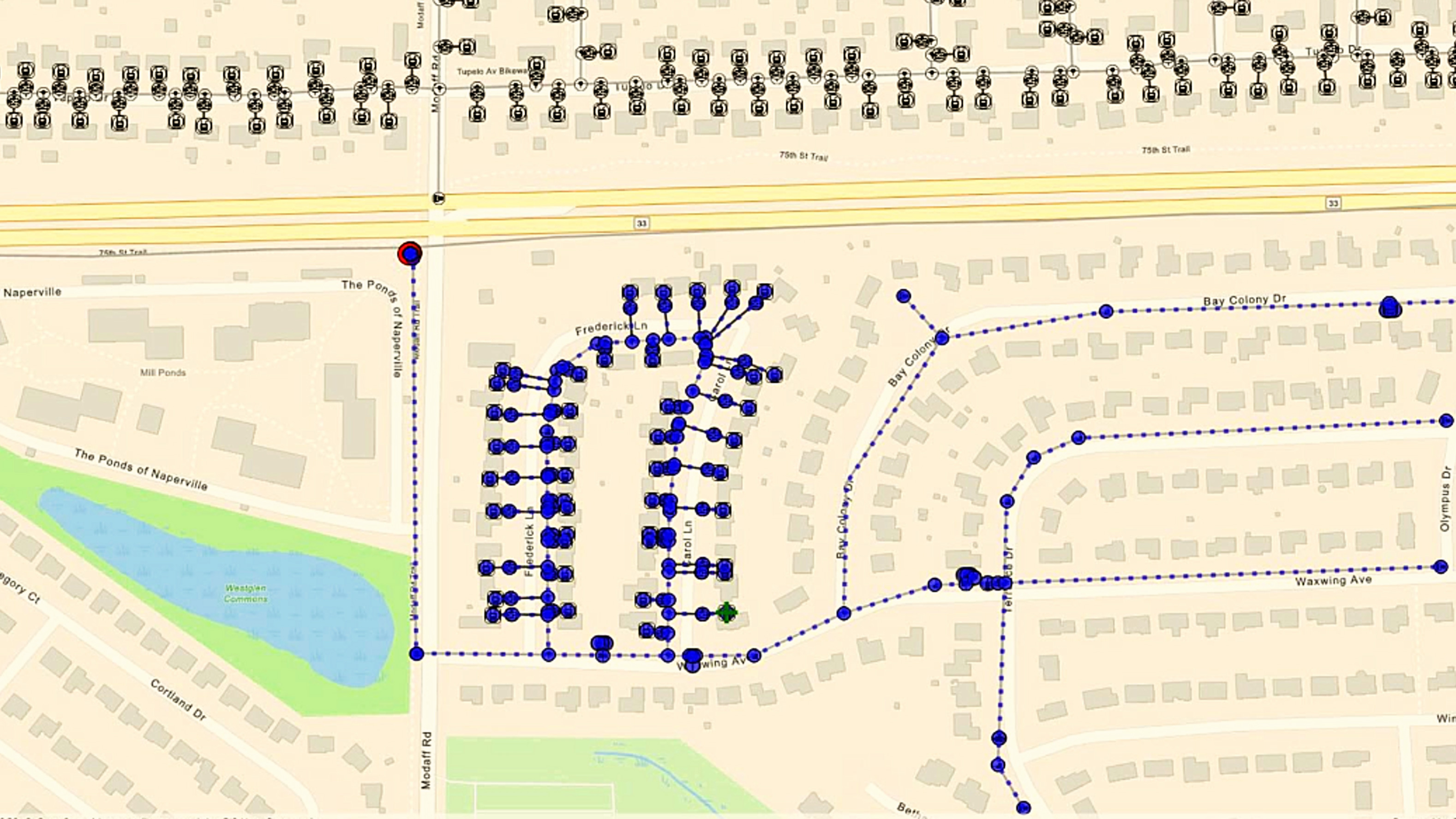  A utility asset map showing a connected network in a residential area with blue dots