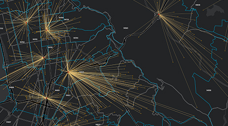Black digital image of a land mass with yellow starburst lines scattered around the map