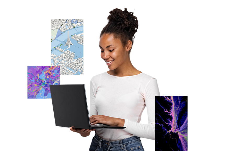 A young girl wearing a white top typing on a black laptop