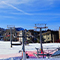 People at a snowy ski resort in Colorado, widely spaced to maintain social distancing