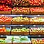 Wicker baskets of fruits and vegetables on display in a store