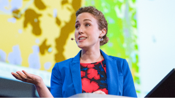 Lauren Bennet, Software Development Team Lead, presenting on stage