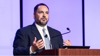 Ryan Lanclos, director of Public Safety Solutions and Disaster Response, presenting on stage